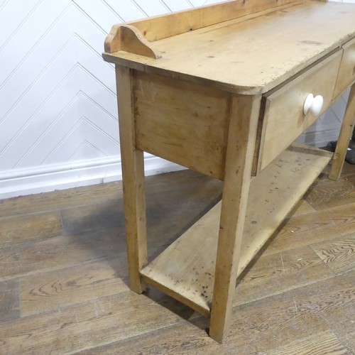 375 - An early 20thC pine Dresser Base, with two draws, W 137.5cm x H 92cm x D 42cm.