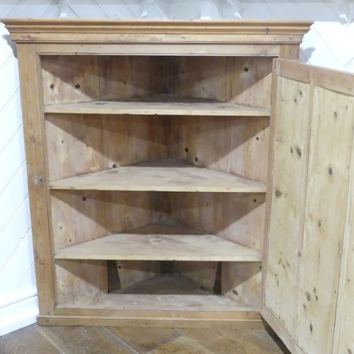 377 - A 20thC pine Corner Cupboard, made up from two corner cupboards stack on the other, W 98cm x H 203.5... 