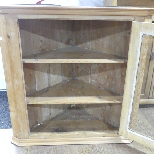 377 - A 20thC pine Corner Cupboard, made up from two corner cupboards stack on the other, W 98cm x H 203.5... 