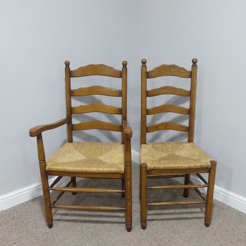 374 - A set of twelve early 20thC oak ladder-back Dining Chairs, made up of two carver chairs with elbow r... 