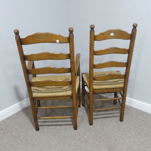 374 - A set of twelve early 20thC oak ladder-back Dining Chairs, made up of two carver chairs with elbow r... 