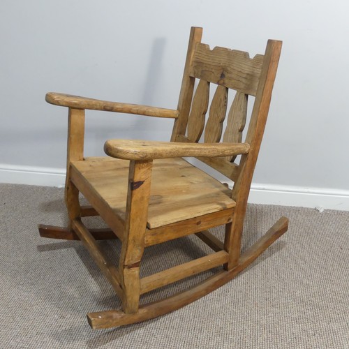 381 - A 20thC carved pine Rocking Chair, W 69cm x H 92.5cm x D 92cm.