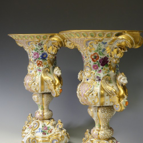 124 - A good pair of late 19thC ornate continental porcelain Vases, probably French, of two-handled oval f... 