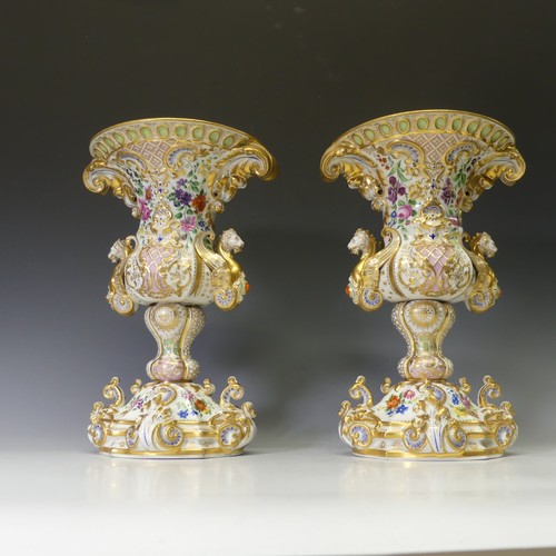 124 - A good pair of late 19thC ornate continental porcelain Vases, probably French, of two-handled oval f... 