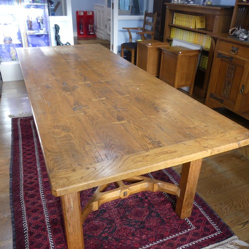 469 - A craftsman made oak table with peg construction, table top made of 5 planks together with cleated e... 