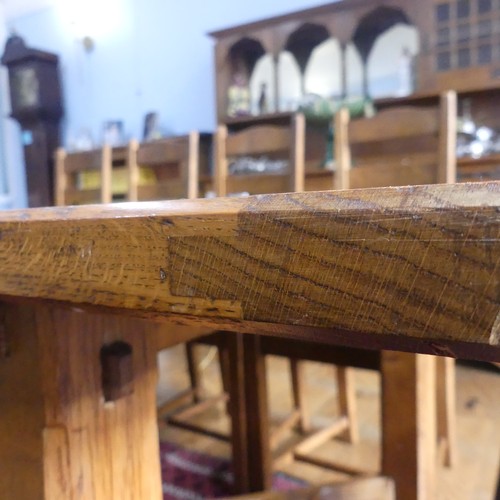 469 - A craftsman made oak table with peg construction, table top made of 5 planks together with cleated e... 