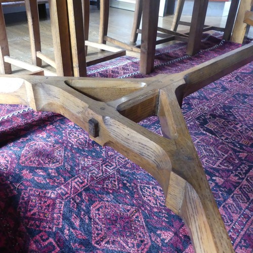 469 - A craftsman made oak table with peg construction, table top made of 5 planks together with cleated e... 