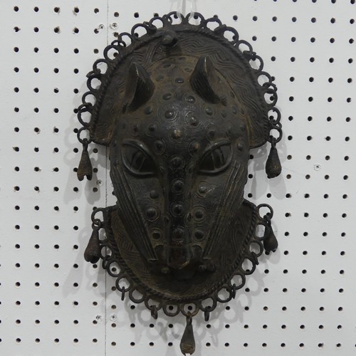 176 - Tribal art; a Benin bronze leopard mask with punched and raised decoration, edged with ring loops an... 