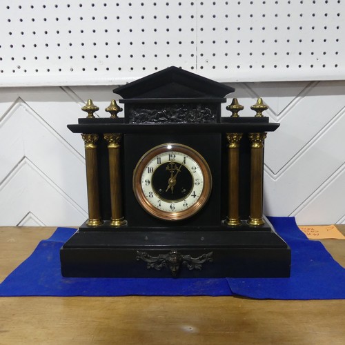 263 - A late Victorian black slate Mantel Clock, of architectural form with gilt metal columns and finials... 