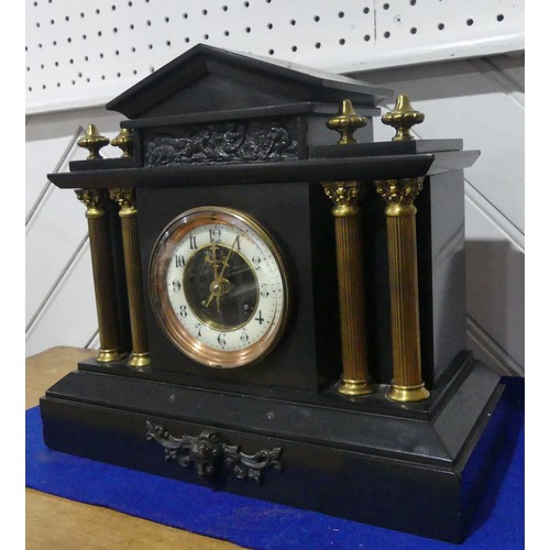 263 - A late Victorian black slate Mantel Clock, of architectural form with gilt metal columns and finials... 