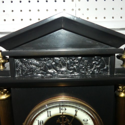 263 - A late Victorian black slate Mantel Clock, of architectural form with gilt metal columns and finials... 