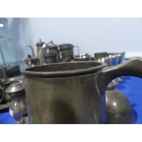 296 - A 19thC pewter Quart Mug, together with a quantity of other 19th and ealy 20thC pewter mugs, two cof... 