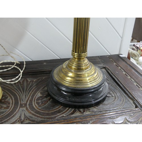 301 - A Victorian brass column Duplex Oil Lamp, having a painted opaque pink font and Duplex burner, raise... 