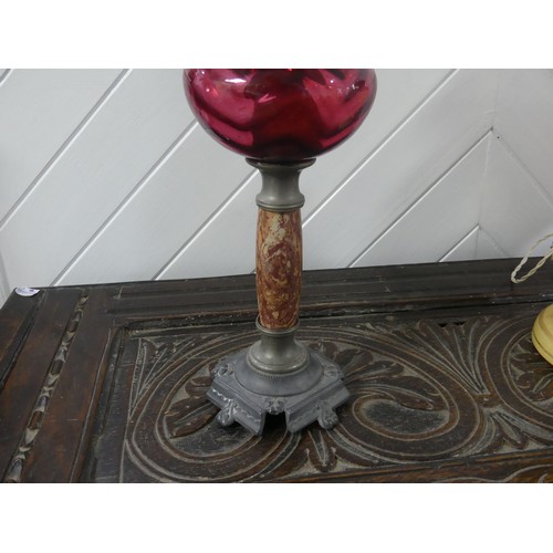 301 - A Victorian brass column Duplex Oil Lamp, having a painted opaque pink font and Duplex burner, raise... 