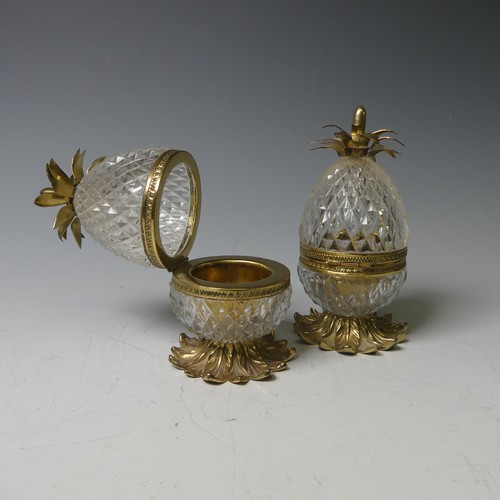 34 - A pair of French glass and gilt metal pineapple form Boxes, on a multi-leaf domed base and topped wi... 