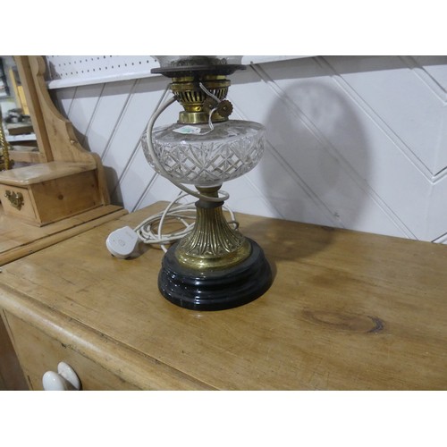 306 - A brass and cut glass Oil Lamp, having a cut clear glass font and frosted shade, on plinth base, con... 