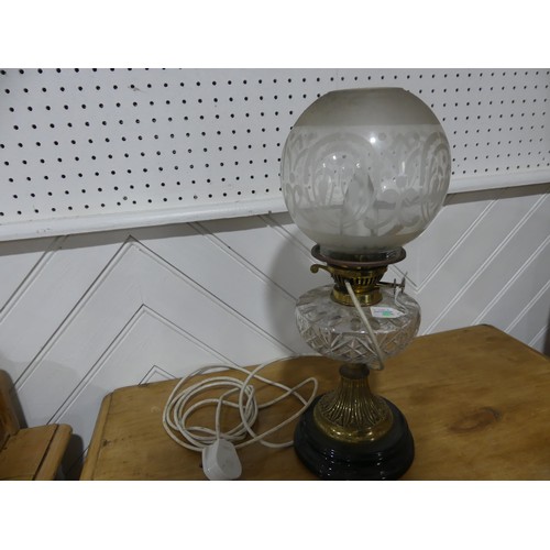 306 - A brass and cut glass Oil Lamp, having a cut clear glass font and frosted shade, on plinth base, con... 