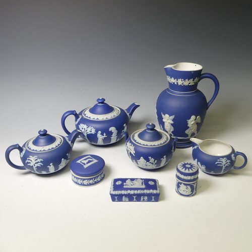 65 - A Wedgwood dark blue Jasperware part Tea Service, including two Teapots, Sucrier, Cream Jug, togethe... 