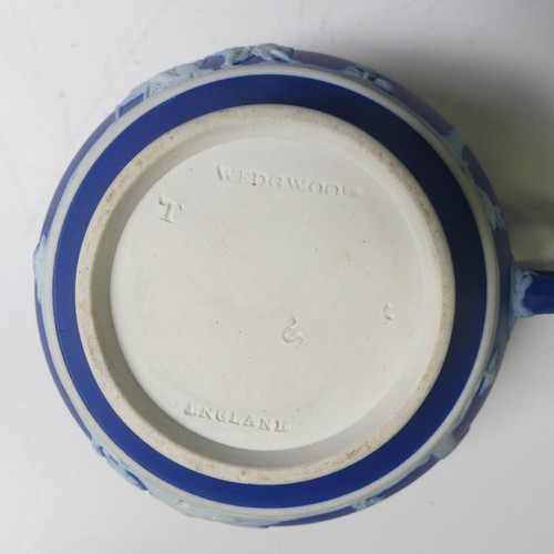 65 - A Wedgwood dark blue Jasperware part Tea Service, including two Teapots, Sucrier, Cream Jug, togethe... 