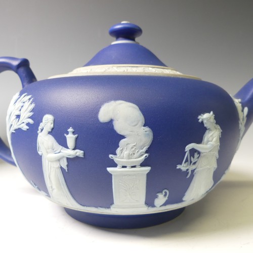 65 - A Wedgwood dark blue Jasperware part Tea Service, including two Teapots, Sucrier, Cream Jug, togethe... 