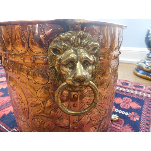 308 - An early 20thC ornate copper and brass Coal Bucket, having embossed and etched decoration of an armo... 