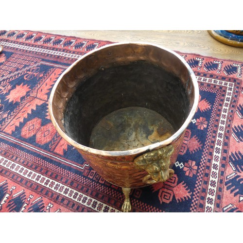 308 - An early 20thC ornate copper and brass Coal Bucket, having embossed and etched decoration of an armo... 