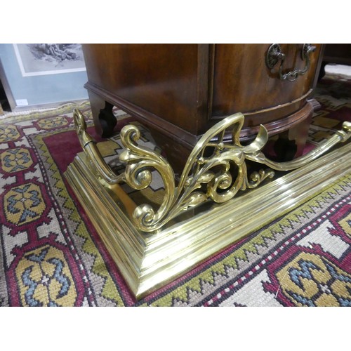 320 - A brass fire fender with ornate gallery, 133cmL x 36cmD x17H.