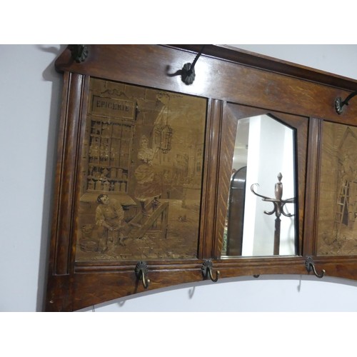 398 - An early 20thC Arts and crafts style oak Hall Mirror with hooks and tapestry panels, W 125cm x H 80c... 