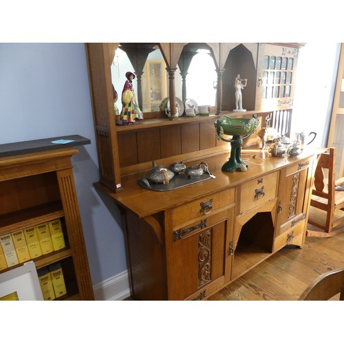 399 - An Arts & Crafts light oak Dresser, in the manner of Shapland & Petter, Barnstaple, of asymm... 