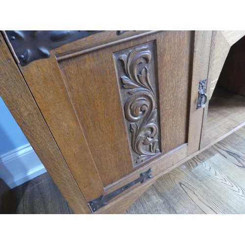 399 - An Arts & Crafts light oak Dresser, in the manner of Shapland & Petter, Barnstaple, of asymm... 