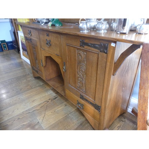 399 - An Arts & Crafts light oak Dresser, in the manner of Shapland & Petter, Barnstaple, of asymm... 