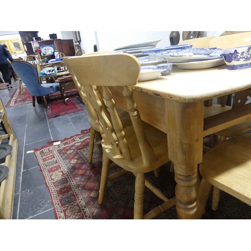 407 - A pine kitchen Table with six Chairs, only one frieze drawer present, W 136cm x H 77cm x D 76cm (tab... 