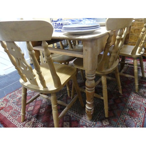 407 - A pine kitchen Table with six Chairs, only one frieze drawer present, W 136cm x H 77cm x D 76cm (tab... 