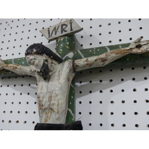 412 - A Guatemalan primitive handmade religious folk art wooden Crucifix, depicting Jesus on the cross, pa... 