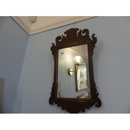 426 - A Georgian style walnut fretwork Wall Mirror, of a small size. W 35cm x H 59 cm.