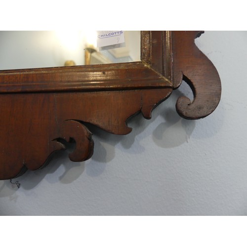 426 - A Georgian style walnut fretwork Wall Mirror, of a small size. W 35cm x H 59 cm.