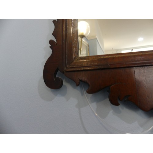 426 - A Georgian style walnut fretwork Wall Mirror, of a small size. W 35cm x H 59 cm.