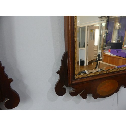 427 - A pair of Georgian style mahogany Fretwork Wall Mirrors, both have crests carved with a exotic bird ... 