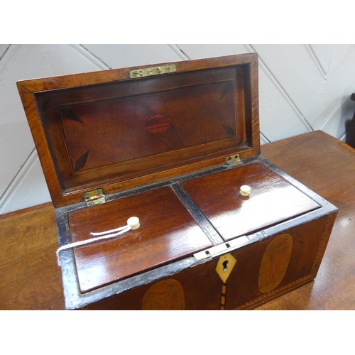 432 - A Georgian mahogany Tea Caddy, with shell inlays and ivory escutcheon, the two section interior with... 