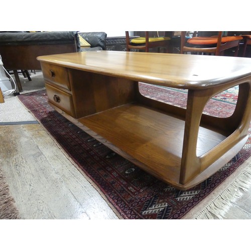 456 - An Ercol dark blonde Windsor Minerva Coffee Table, with two drawers and open display section, raised... 