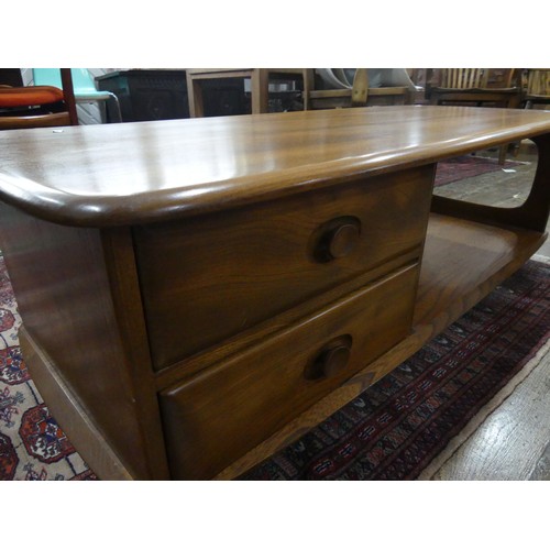 456 - An Ercol dark blonde Windsor Minerva Coffee Table, with two drawers and open display section, raised... 