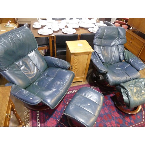 462 - A pair of Erkones Stressless leather Armchair, with matching footstools, the chair 72cm wide, worn (... 