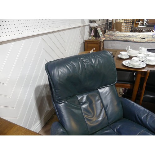 462 - A pair of Erkones Stressless leather Armchair, with matching footstools, the chair 72cm wide, worn (... 