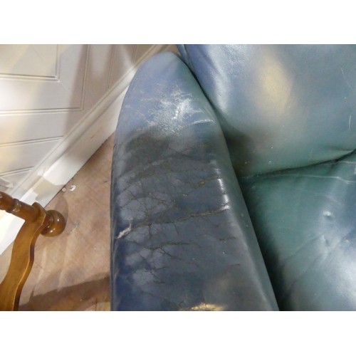 462 - A pair of Erkones Stressless leather Armchair, with matching footstools, the chair 72cm wide, worn (... 