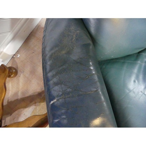 462 - A pair of Erkones Stressless leather Armchair, with matching footstools, the chair 72cm wide, worn (... 