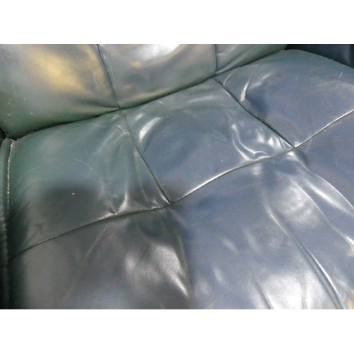 462 - A pair of Erkones Stressless leather Armchair, with matching footstools, the chair 72cm wide, worn (... 