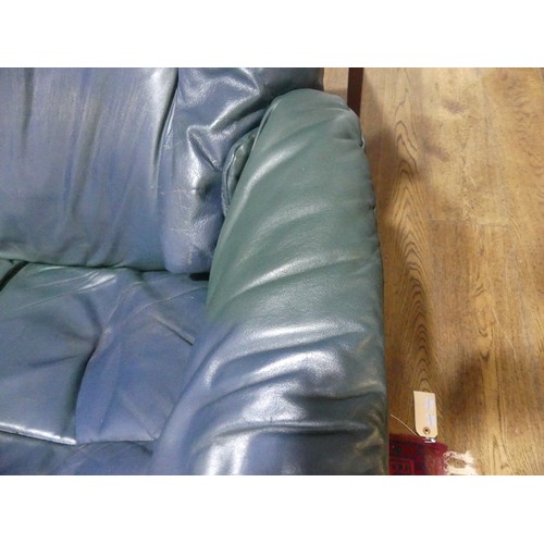 462 - A pair of Erkones Stressless leather Armchair, with matching footstools, the chair 72cm wide, worn (... 