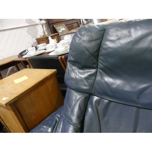 462 - A pair of Erkones Stressless leather Armchair, with matching footstools, the chair 72cm wide, worn (... 