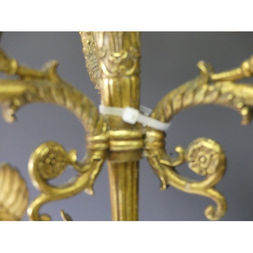 468 - A pair of late 19th century French gilt metal four branch figural Candelabra, the central cupid figu... 