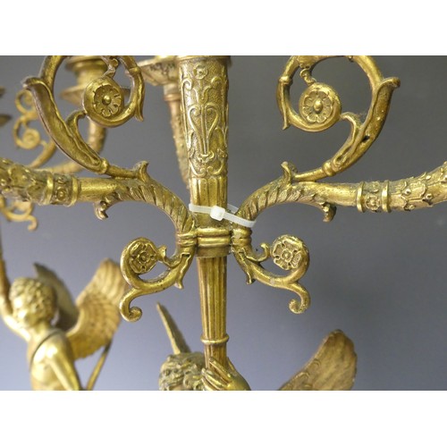 468 - A pair of late 19th century French gilt metal four branch figural Candelabra, the central cupid figu... 